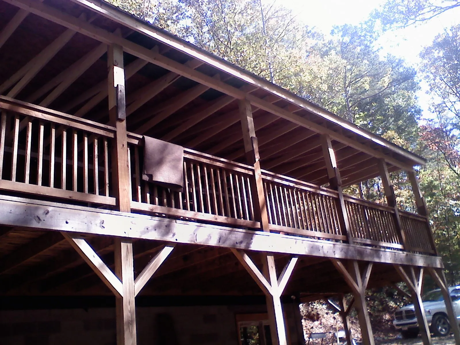 Timber framing under a new elevated porch and deck — Roof Leak Repair in Foster by Roofing Brothers